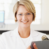 Woman with eyeglasses holding clipboard smiling