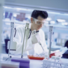Technician Doing an Experiment on DNA Sequencing in a Laboratory
