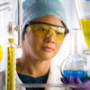 Scientist in chemical laboratory, close up