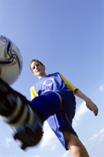 footballer dribbling the ball
