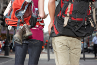 Backpackers checking guidebook on London street