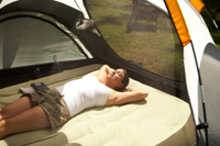 Woman relaxing in tent