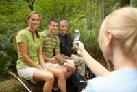 group smiling in forrest