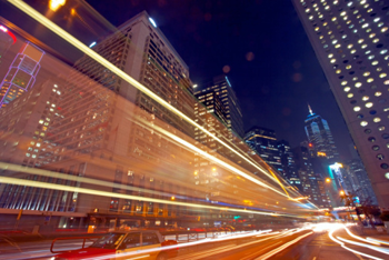 China, Hong Kong, blurred traffic lights in central district at night