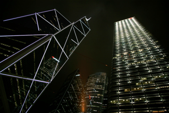 China, Hong Kong, low angle view of skyscrapers at night