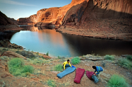 Hikers prepare an open air campsite